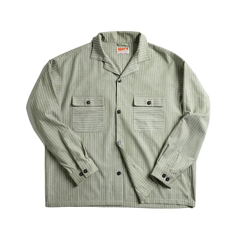 A green and white pinstripe shirt with a Cuban collar and two front chest pockets, each with a buttoned flap, crafted from high-quality cotton and displayed on a white background.