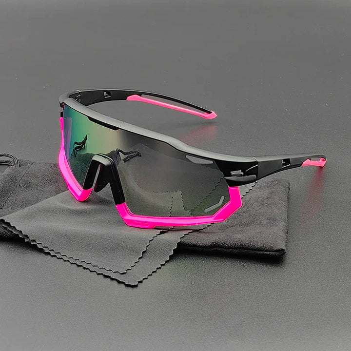 Olympus Sunglasses with a black frame and bright pink accents rest on a black cleaning cloth. These sporty shades feature polarized lenses for UV protection, and their reflective, slightly tinted finish stands out against the dark background.