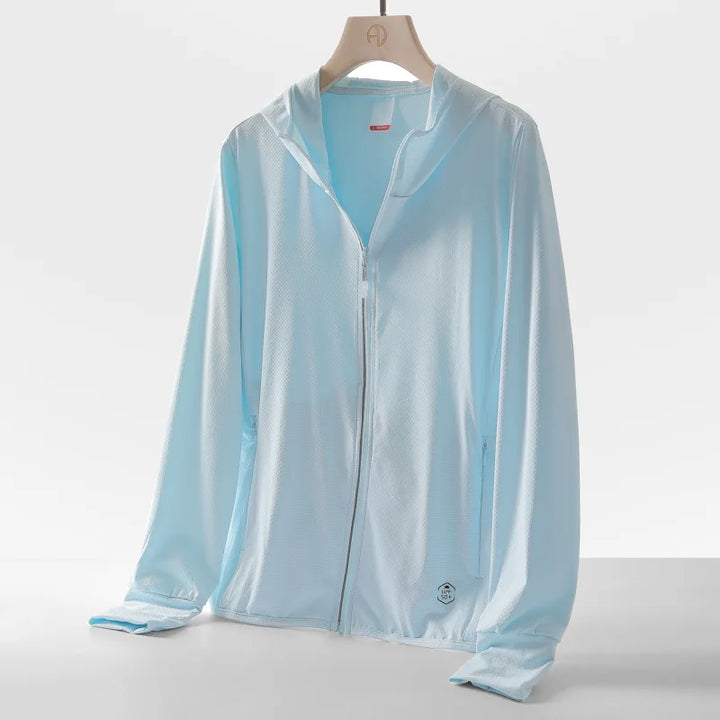 A light blue, long-sleeve zip-up hoodie with a subtle texture, displayed on a hanger against a plain white background. Made from quick-drying fabric, it features a hood, sun protection with UPF 50+, and a small logo near the bottom hem.