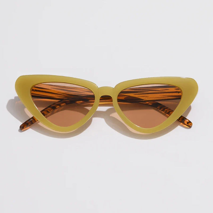 Cat-eye sunglasses with thick yellowish-green frames and brown-tinted lenses, offering UV400 sun protection. The temples feature a subtle striped pattern, adding flair to this lightweight eyewear, displayed on a white background.