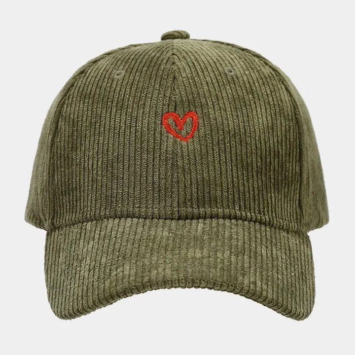 A green corduroy baseball cap featuring a small red heart embroidery on the front center, combining classic style with the unique texture of corduroy hats.