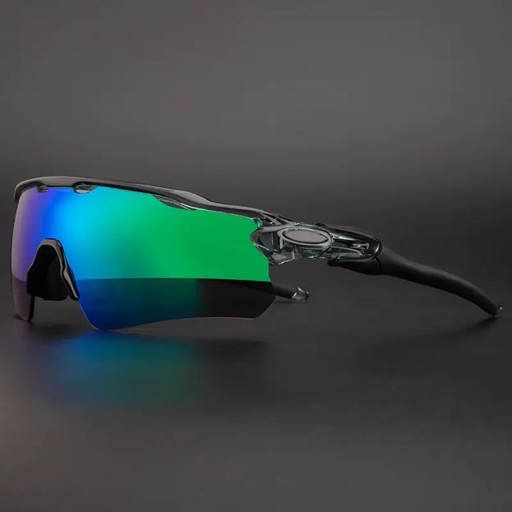 A pair of sporty polarized cycling sunglasses with a transparent frame and reflective green-tinted lenses offering UV protection, shown against a dark background.