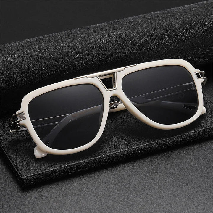 White-framed vintage sunglasses with dark lenses rest on a black textured case against a dark background, exuding classic aviator style and timeless appeal.