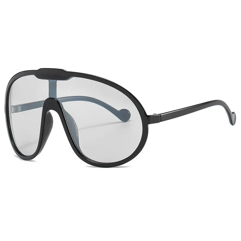 A pair of oversized sunglasses with black rims, large clear lenses, and curved arms, shown on a white background—perfect for outdoor activities with stylish UV400 protection.