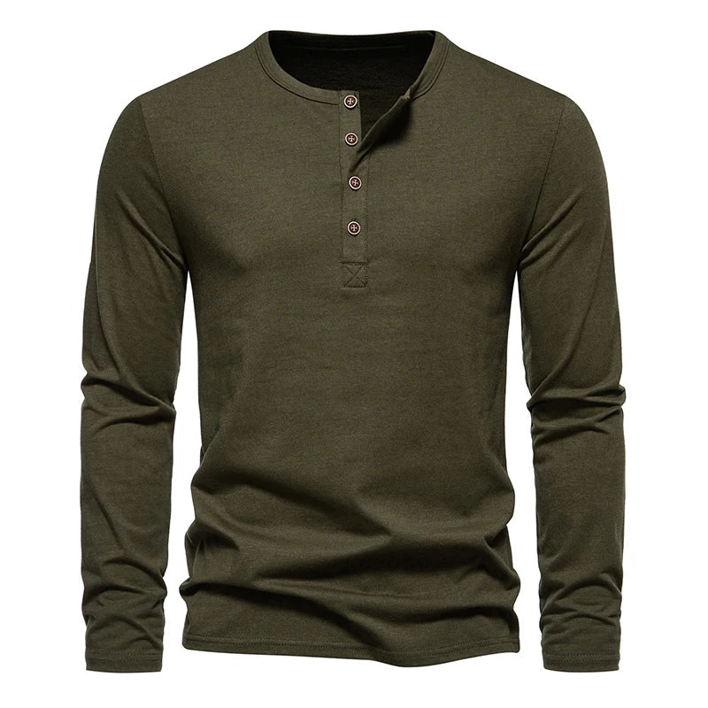 A long-sleeve, olive green Henley shirt made from breathable cotton, featuring a classic design with four buttons on the placket and a round neckline, displayed against a white background.