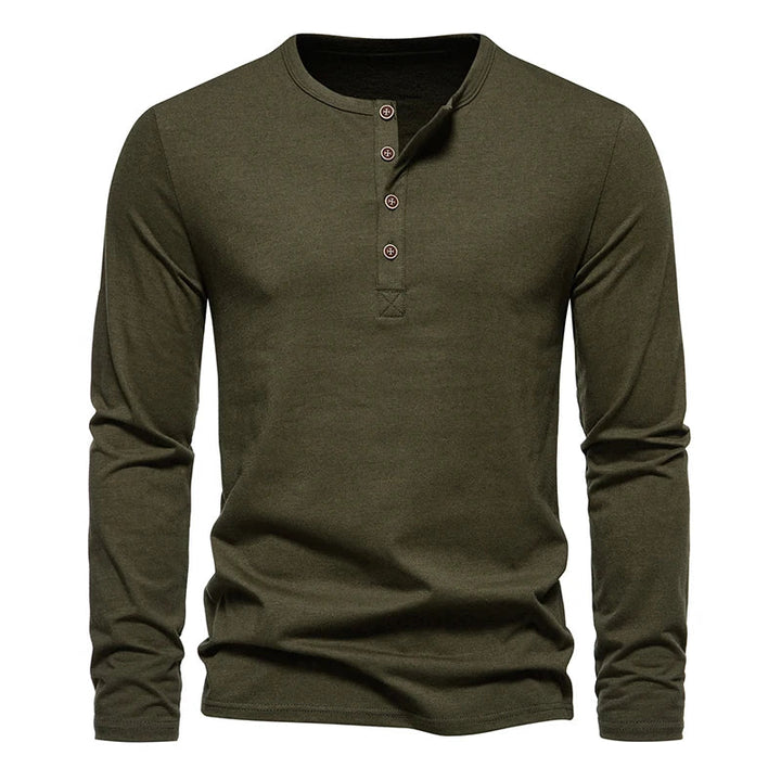 A long-sleeve, olive green Henley shirt made from breathable cotton, featuring a classic design with four buttons on the placket and a round neckline, displayed against a white background.