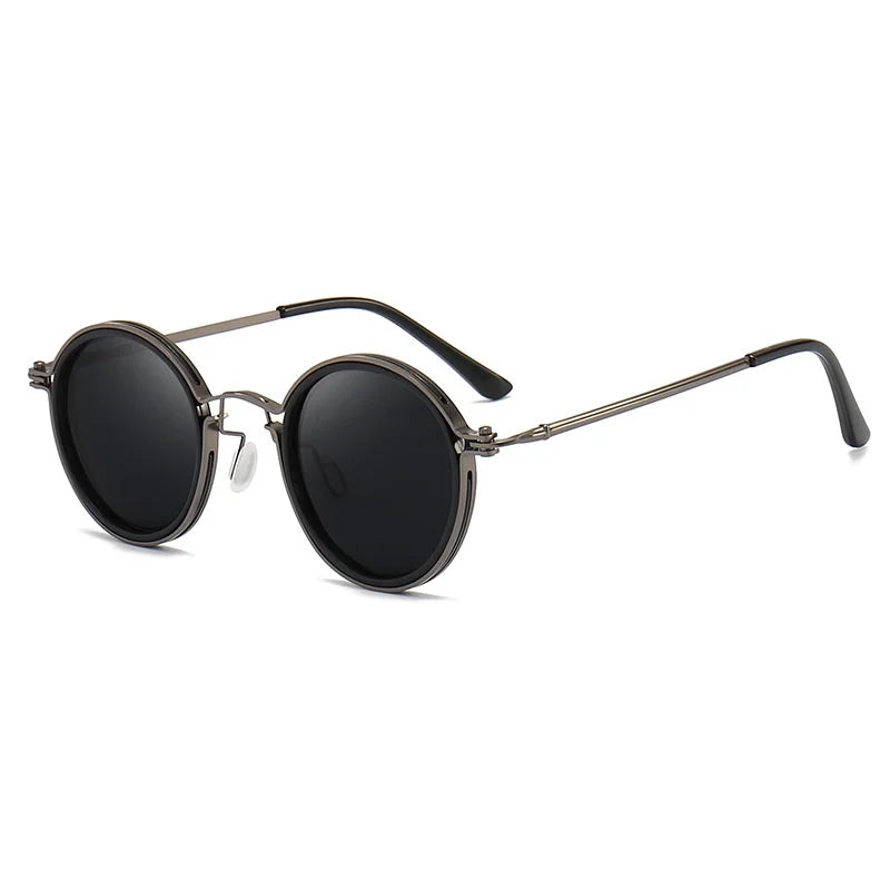 Round black Ruby Ray Sunglasses with dark polarized lenses and thin metal frames, featuring a double bridge and black plastic-coated temple tips. Enjoy stylish UV400 protection, displayed elegantly on a white background.