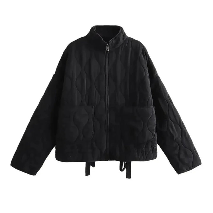 A black quilted bomber jacket with a high collar, front zipper, two large front pockets, and long sleeves. The jacket features padded insulation, a loose fit, and subtle stitched wave patterns throughout.