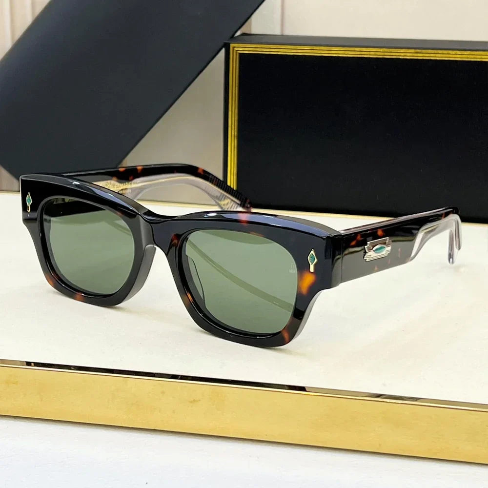 A pair of vintage-inspired, square tortoiseshell sunglasses with green lenses is displayed on a white and gold surface, with a black and gold box in the background. Enjoy stylish UV400 protection for your eyes.