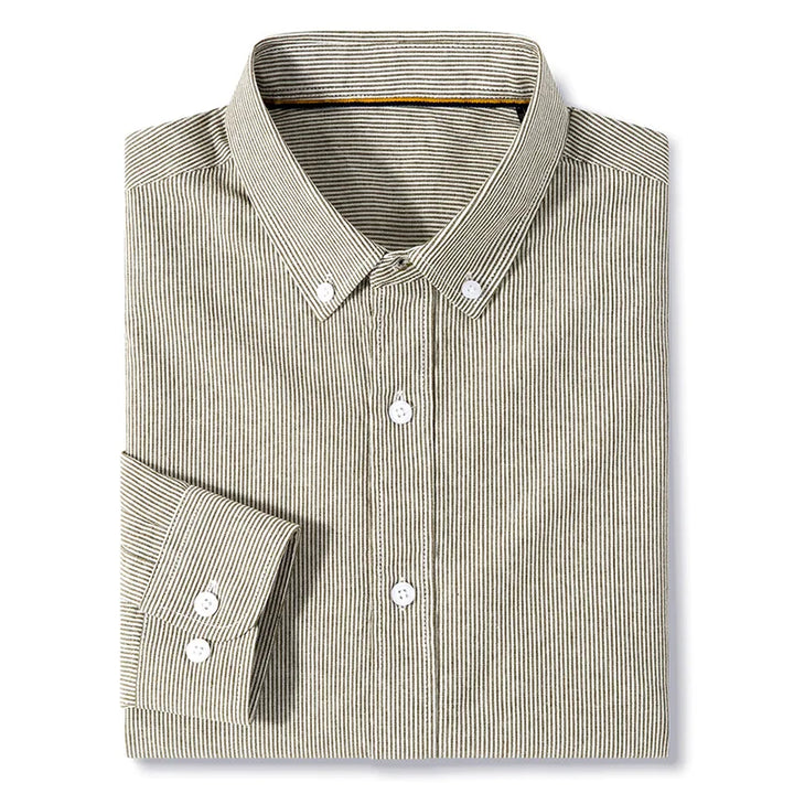 A neatly folded, classic pinstripe shirt with thin black and white vertical stripes. This cotton button-up features a collar and white buttons on the front and cuffs, combining timeless style with everyday comfort.