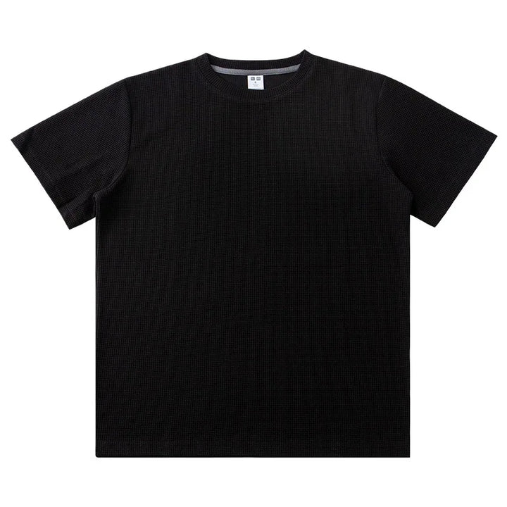 A plain black short-sleeve crew neck heavyweight shirt, crafted from soft 260G cotton, is laid flat on a white background.