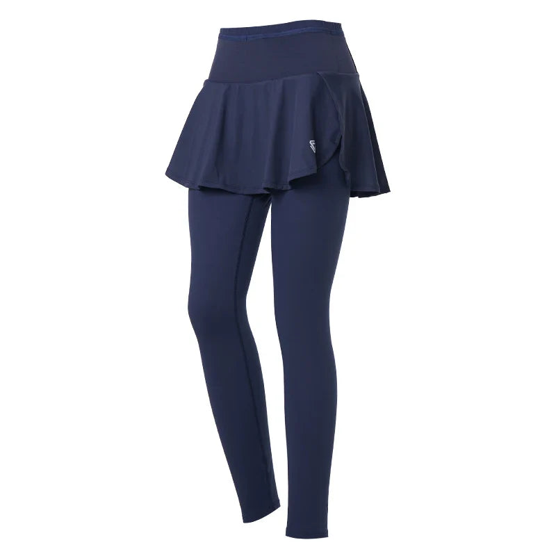 Navy blue skirted leggings with an attached matching flared skirt, displayed on a white background. The skirt sits at the waist, offering high-waisted support, and the leggings are full-length.