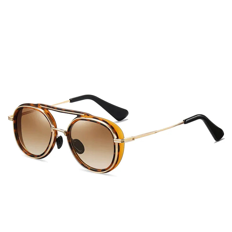 Round sunglasses with brown tortoiseshell frames, gold thin arms, black tips, and brown gradient lenses offer a stylish twist on high-end eyewear, displayed on a white background.