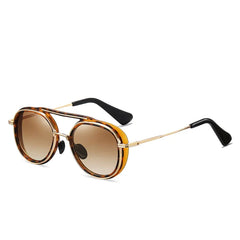 Round sunglasses with brown tortoiseshell frames, gold thin arms, black tips, and brown gradient lenses offer a stylish twist on high-end eyewear, displayed on a white background.