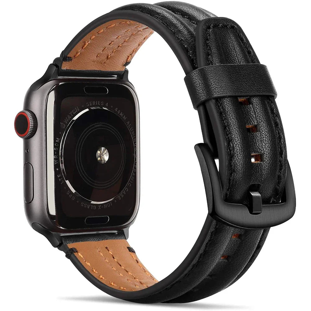 A close-up view of a leather Apple Watch band shows a brown leather underside and black top strap, featuring black stitching and a black metal buckle. The sensor and text details on the watch’s back are clearly visible.