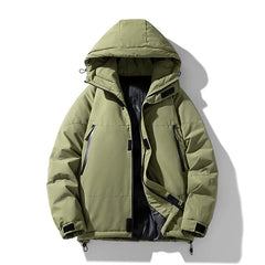 Light olive green windproof puffer jacket with a detachable hood, black zipper and pocket details, adjustable cuffs, and a partially open front revealing a dark inner lining. The insulated jacket is displayed against a white background.