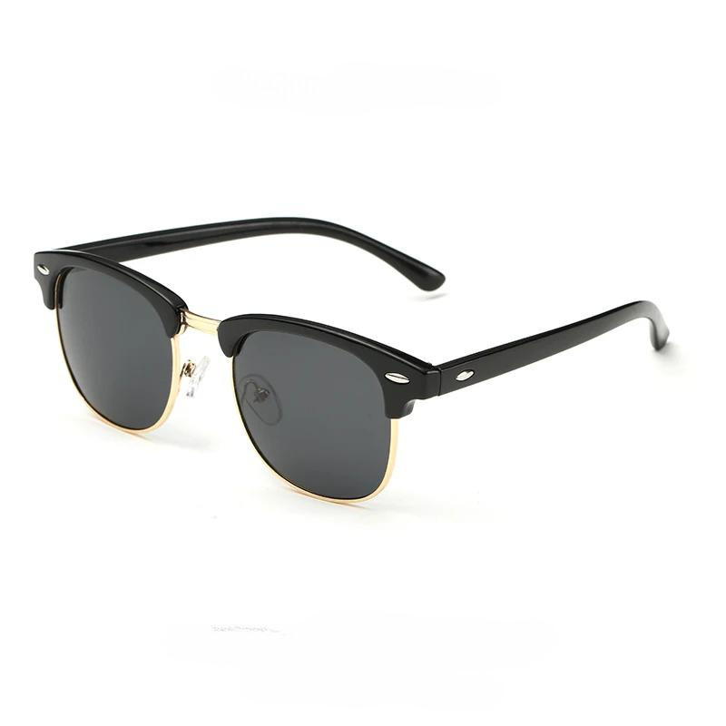 A pair of black and gold clubmaster-style vintage sunglasses with dark lenses, featuring a black top frame, gold lower rims, and black arms with silver accents near the hinges for classic style and UV protection.