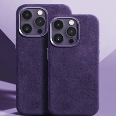 Two smartphones with triple-lens cameras are shown side by side, each in a purple alcantara phone case with a suede finish, set against a purple geometric background.
