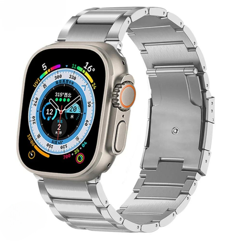 A silver smartwatch with a rectangular face displays a colorful digital interface and a metal link band. Crafted from Grade 2 Titanium, it features lightweight durability, an adjustable fit, and distinctive orange and oval side buttons.