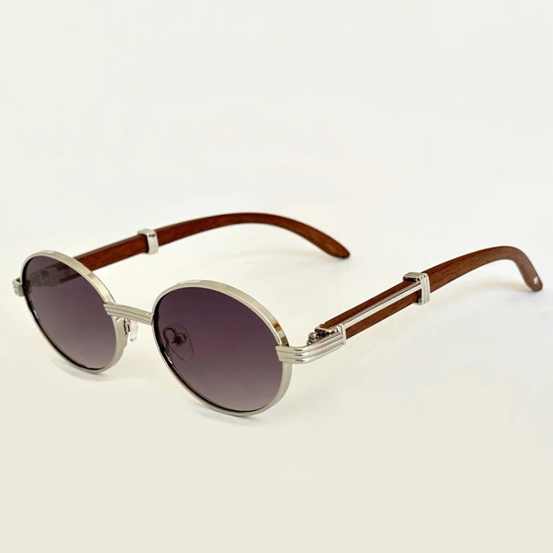 Vintage round sunglasses featuring silver metal frames, dark tinted UV400 protection lenses, and brown wooden temple arms, displayed against a plain white background.
