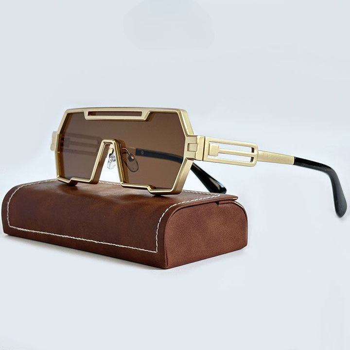 Futuristic gold-rimmed steampunk sunglasses with brown rectangular lenses, thick square frames, and black temple tips, resting on a brown leather case with white stitching.