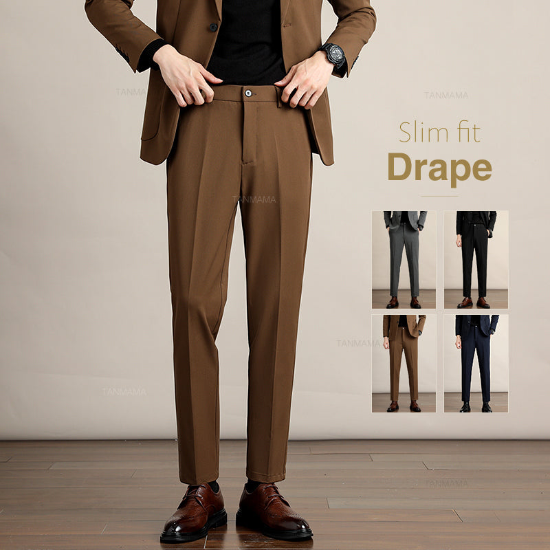 A person wearing a brown slim-fit suit with brown dress shoes stands on a wooden floor. Four small images to the right show the suit in gray, black, brown, and navy. Text reads: Slim fit Drape in Premium Fabric.