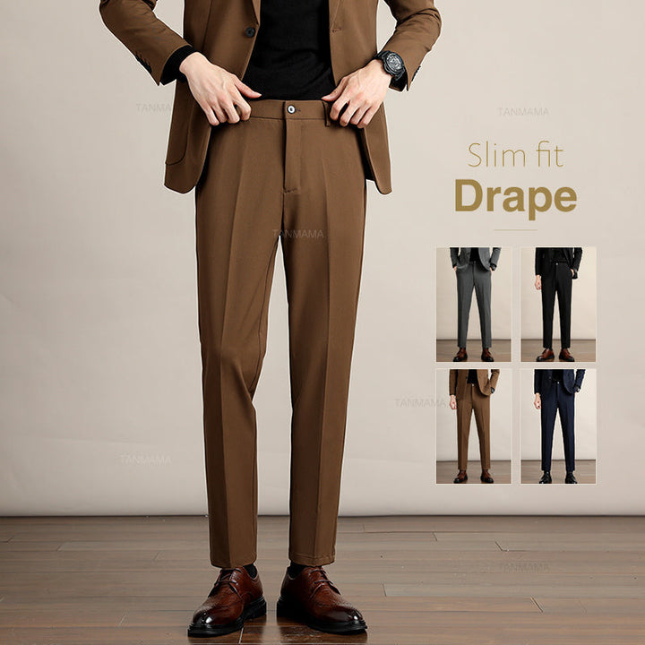 A person wearing a brown slim-fit suit with brown dress shoes stands on a wooden floor. Four small images to the right show the suit in gray, black, brown, and navy. Text reads: Slim fit Drape in Premium Fabric.